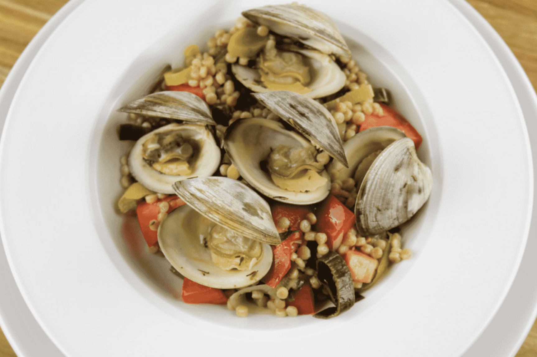 Littleneck Clams with Couscous, Leeks & Tomatoes